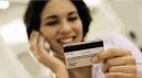 Woman holding credit card.