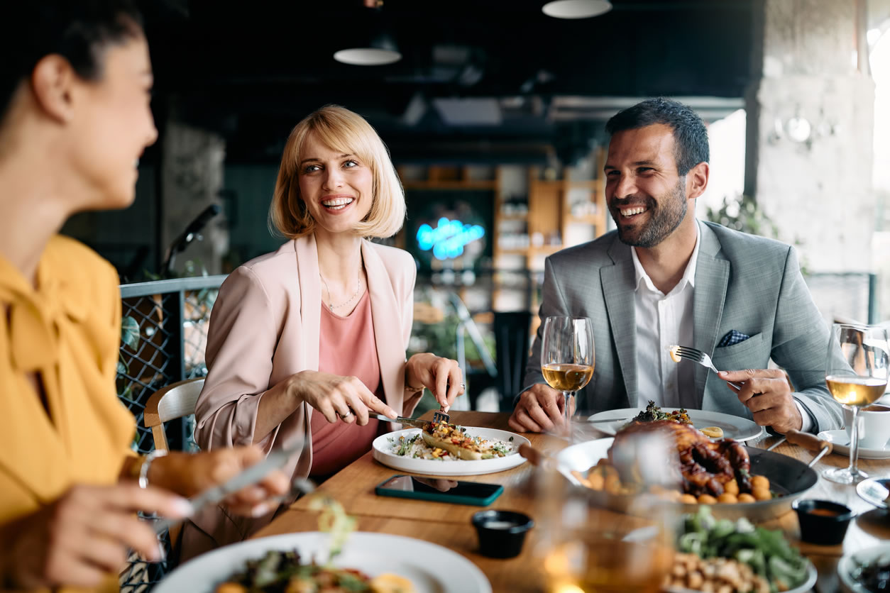 Happy people dining out.