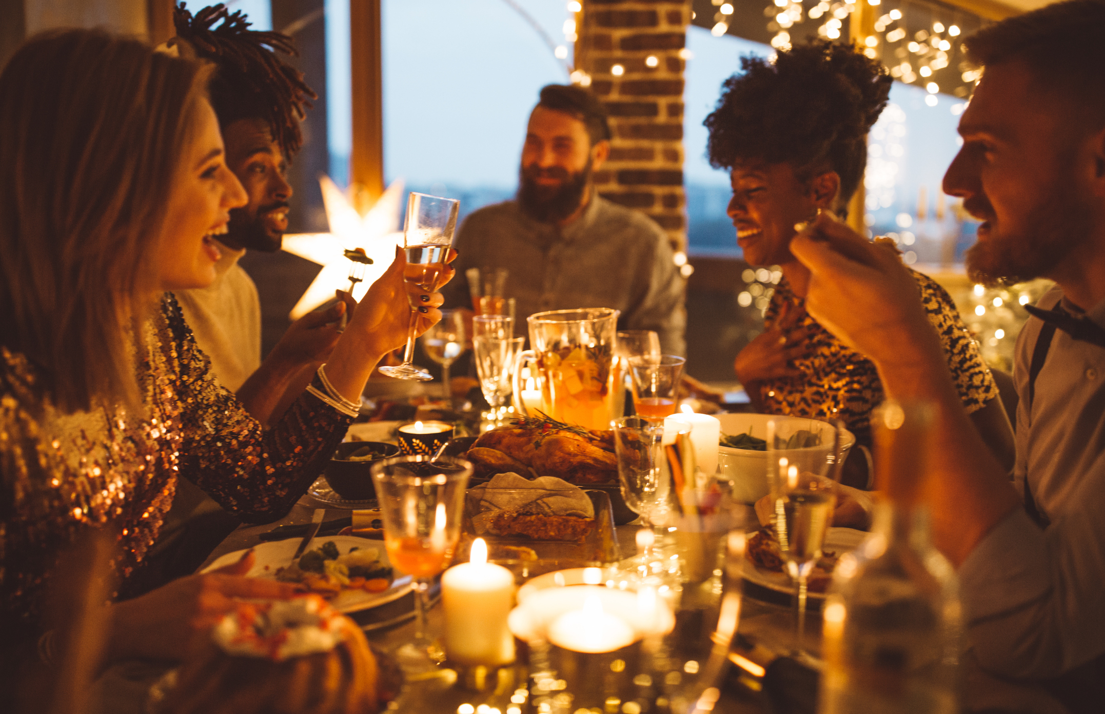 Happy folks enjoying a smashing dinner.