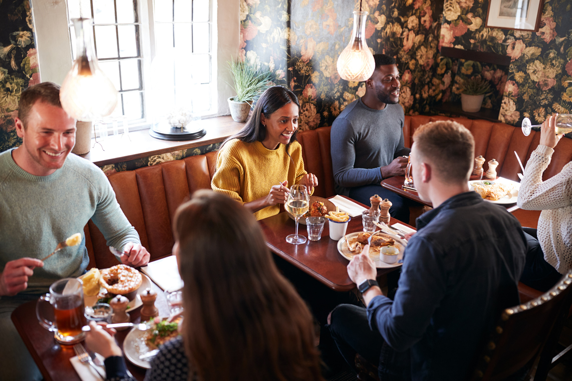 When friends gather for dinner out.