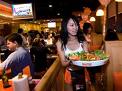 Waiter carrying a plate of hot steaming food.  Menucoverman.com