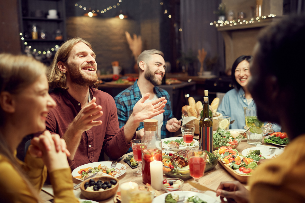 Lively dinner crowd enjoying a beautiful mean.