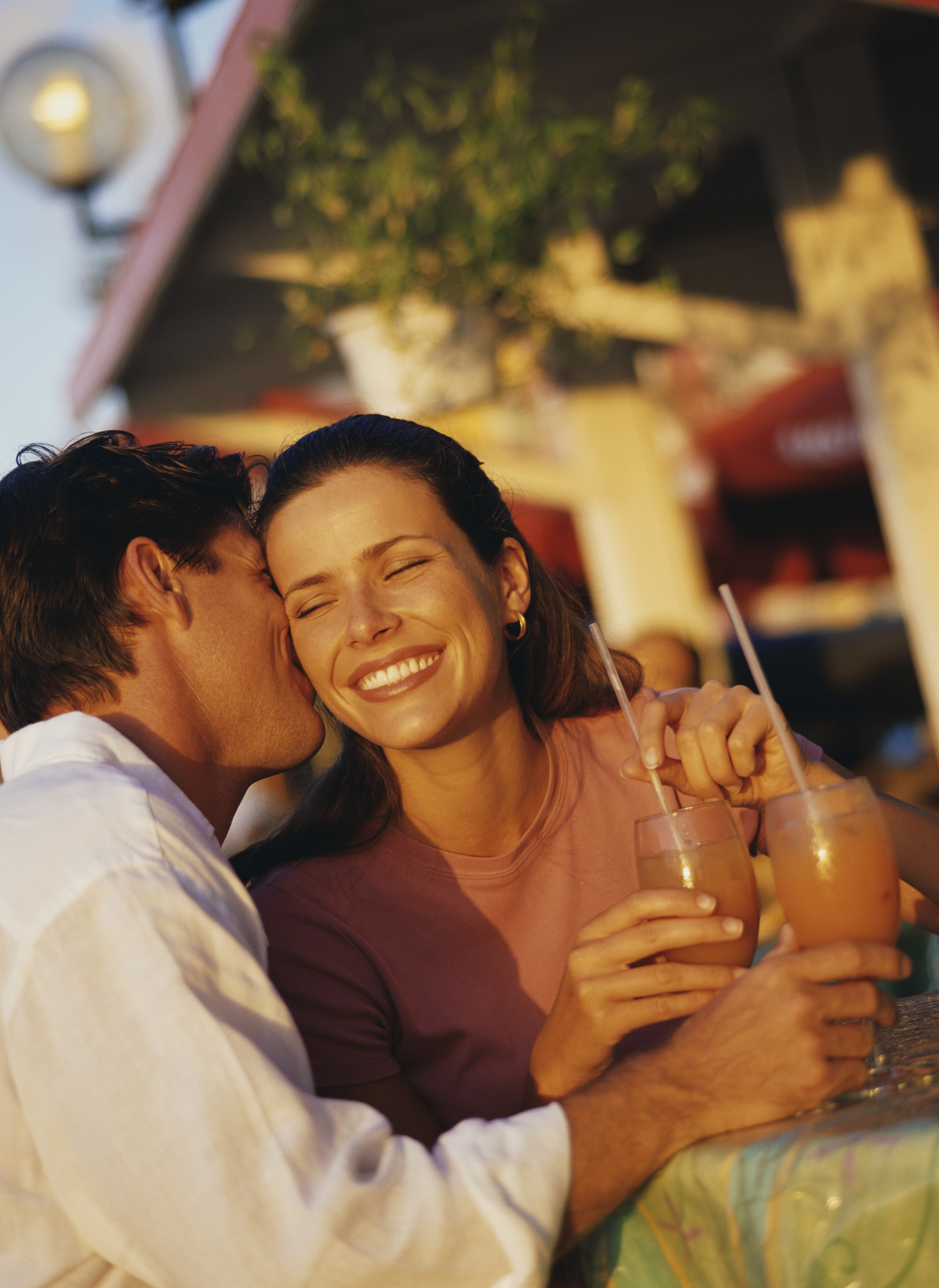 Man kissing woman in the restaurant... oh my!